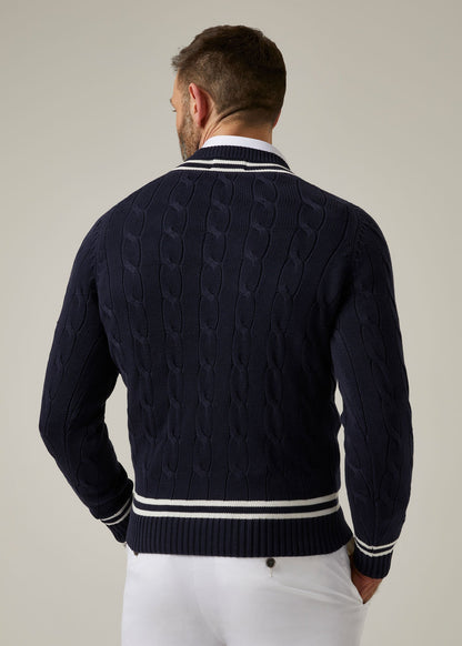 dark navy cable knit cricket jumper with vee neck.