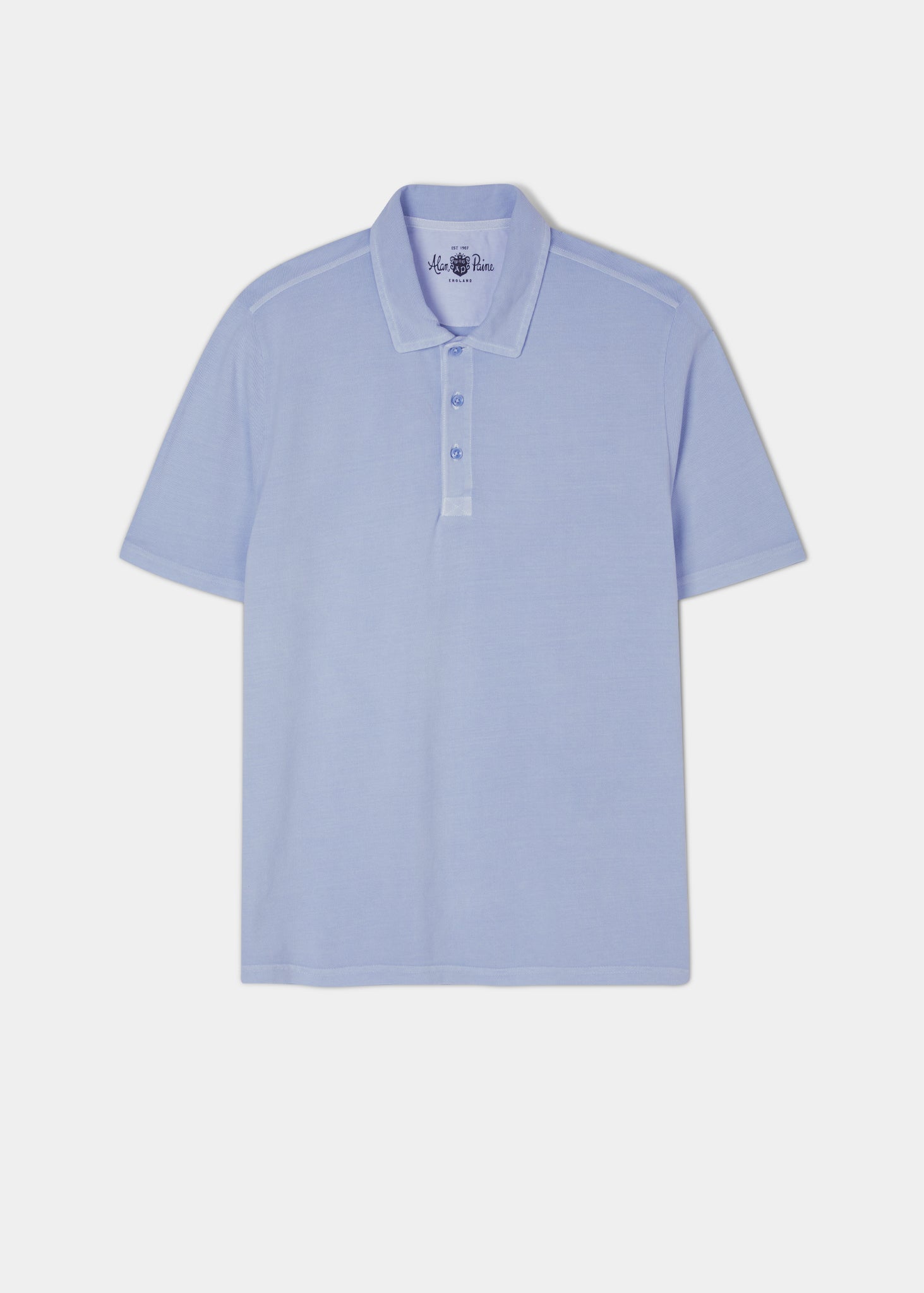 Light blue short sleeve polo shirt made from peruvian cotton.